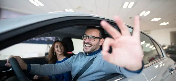 happy-customer-buying-new-car-dealership_342744-710.webp